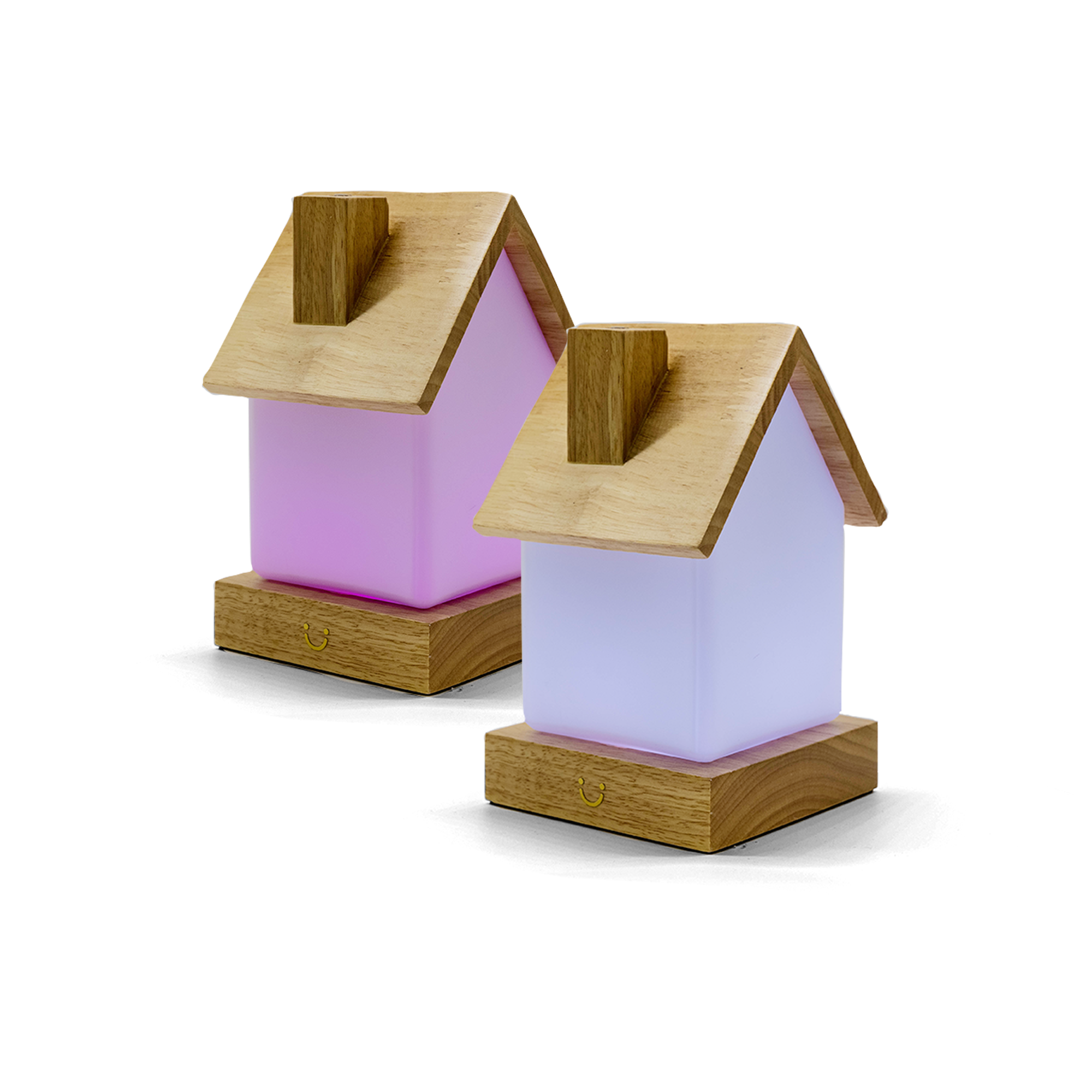 Two house-shaped lamps with pink and lavender bodies and wooden roofs glowing softly.
